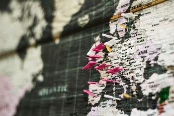 pins showing travel destinations in world map
