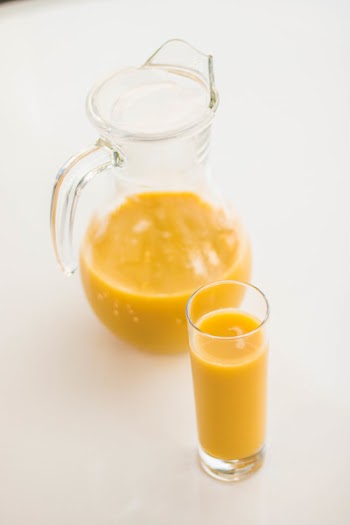 Pitcher And Drinking Glass Filled With Juice