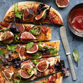 Pizza mozzarella fig and lettuce slices food photography