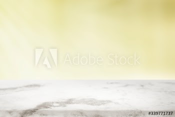 Plain yellow background with white marble