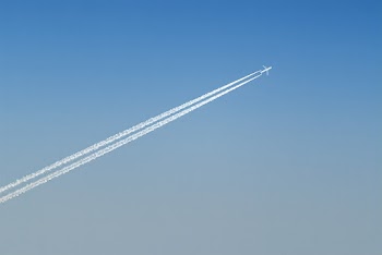 Plane Leaving Cloud Contrails