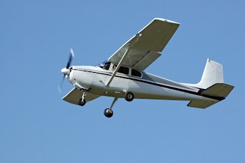Plane on green sky