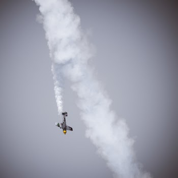 Plane Under Gray Clouds