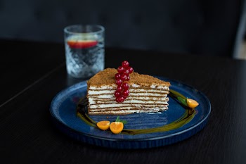 Plate Of Sliced Cake With Berries On Top