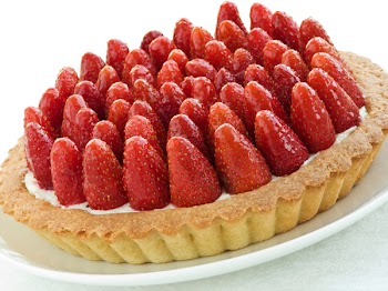 Plate with homemade strawberry tart. Shallow dof.
