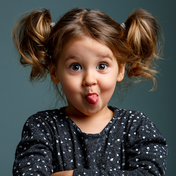 Playful Little Girl Making a Funny Face