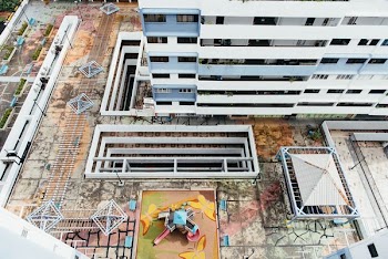 playground between tall buldings