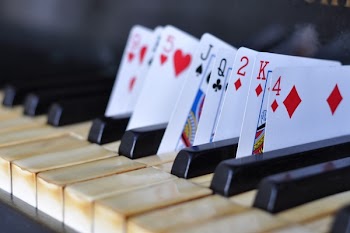 Playing Cards on Piano Keys