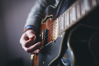 Playing guitar – side shot
