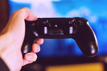 PlayStation pad in a male hand