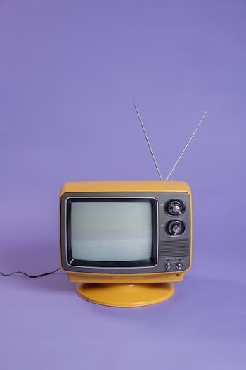 Plugged In Vintage TV on Purple Infinity Background