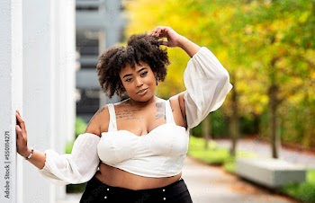 Plus size fashion forward Black woman outside 
