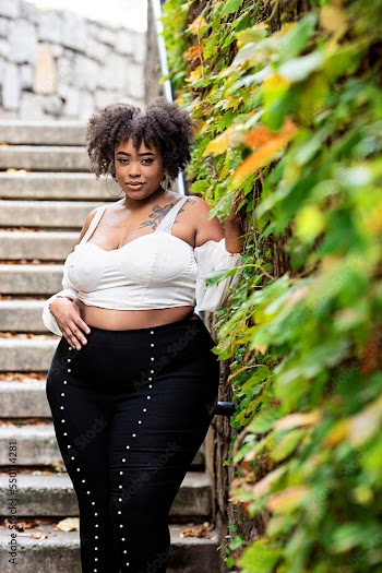 Plus size fashion forward Black woman outside 