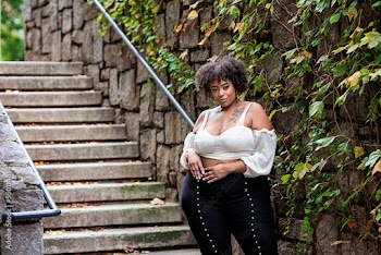 Plus size fashion forward Black woman outside 