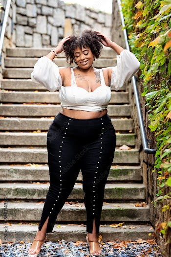 Plus size fashion forward Black woman outside 
