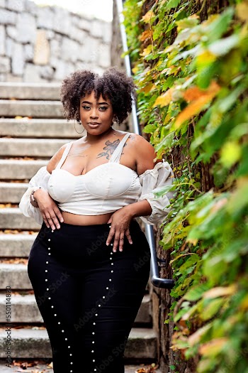 Plus size fashion forward Black woman outside 