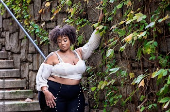 Plus size fashion forward Black woman outside 