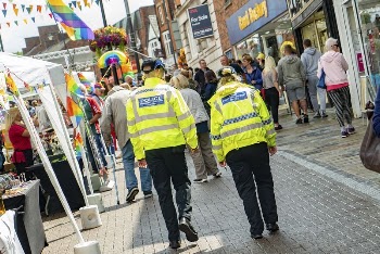 Police officers walking in town, | Free Photo - rawpixel