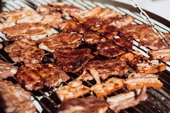 Pork and bacon on the grill closeup