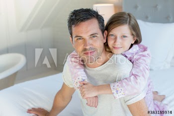 Portrait affectionate father and daughter hugging
