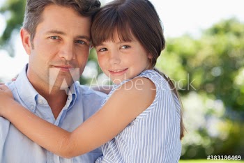 Portrait affectionate father and daughter hugging