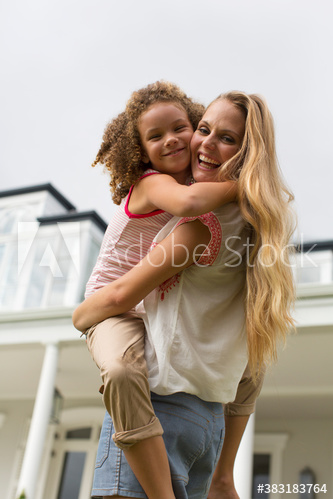 Portrait affectionate mother holding daughter