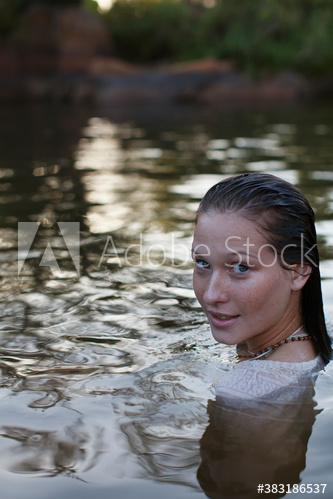 Portrait beautiful young woman swimming in lake