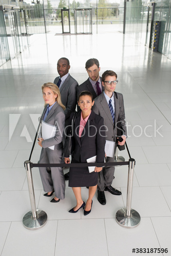 Portrait business people trapped in square stanchion