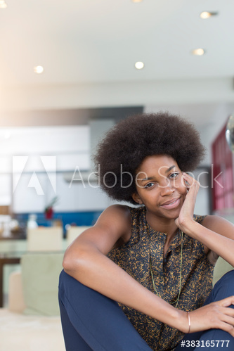 Portrait confident beautiful young woman with afro