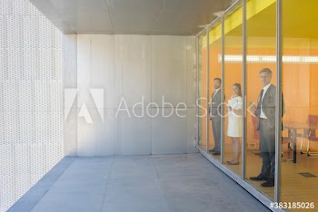 Portrait confident business people at modern office window