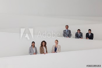 Portrait confident business people on modern office ramps