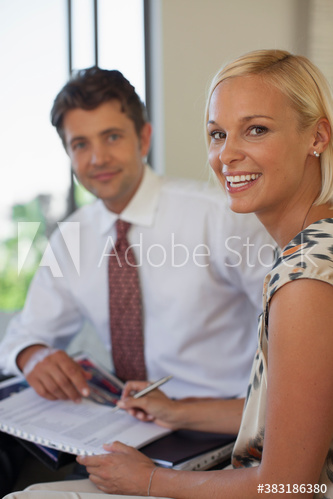 Portrait confident business people with paperwork