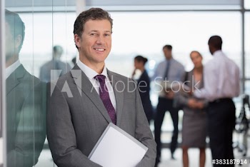 Portrait confident businessman in conference room meeting