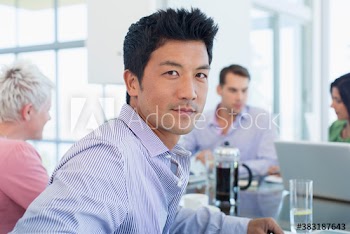 Portrait confident businessman in meeting