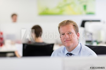 Portrait confident businessman in office