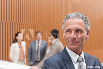 Portrait confident businessman looking away