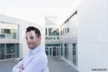Portrait confident businessman on office balcony