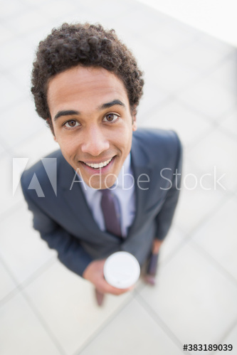 Portrait confident businessman with coffee