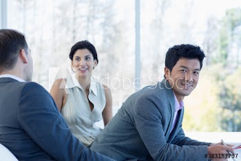 Portrait confident businessman with colleagues