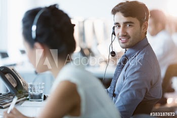 Portrait confident businessman working at call center