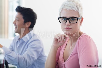 Portrait confident businesswoman in eyeglasses