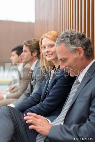 Portrait confident businesswoman with colleagues