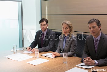 Portrait confident corporate business people in conference room meeting