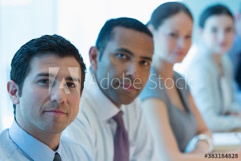 Portrait confident corporate business people in meeting
