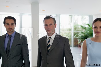 Portrait confident corporate business people in office