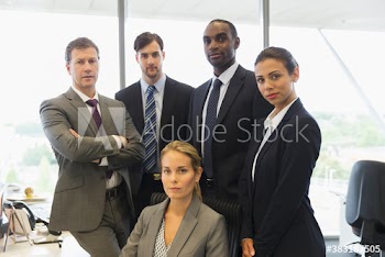 Portrait confident corporate business people in office