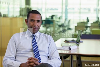 Portrait confident corporate businessman in office