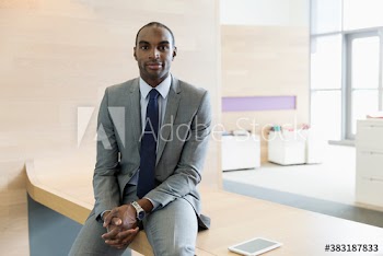 Portrait confident corporate businessman in office