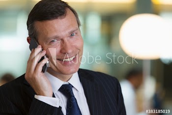 Portrait confident corporate businessman talking on smart phone