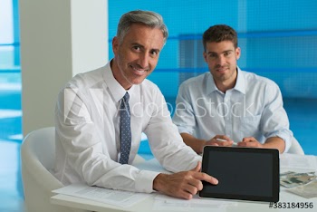 Portrait confident corporate businessmen with digital tablet
